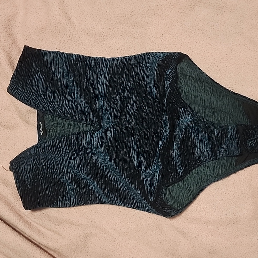 Blue-ish teal body suit with plunging neckline